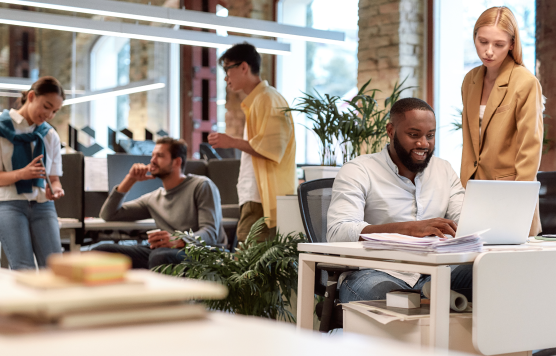 Groups of coworkers working together in an office setting